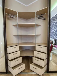 Corner wardrobe with drawers in the bedroom photo