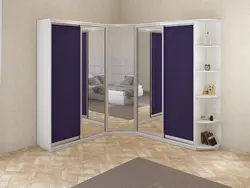 Corner wardrobe with drawers in the bedroom photo