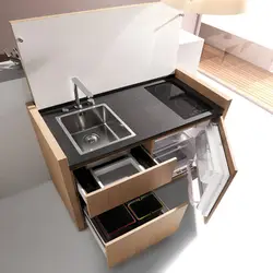 Kitchen with mini refrigerator photo
