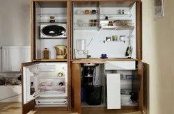 Kitchen with mini refrigerator photo