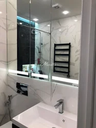 Bathroom built into a niche photo