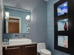 Bathroom built into a niche photo