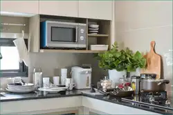 Kitchen design with microwave in the closet