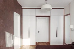 Built-in wardrobe in the hallway with hinged doors design