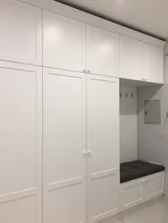 Built-In Wardrobe In The Hallway With Hinged Doors Design