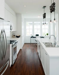 Kitchen design with dark floors and light walls