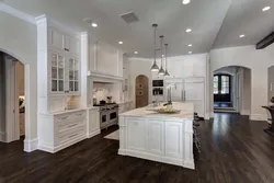 Kitchen design with dark floors and light walls
