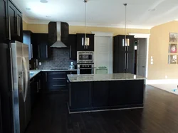 Kitchen design with dark floors and light walls