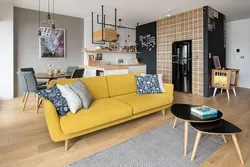 Living room design with mustard sofa