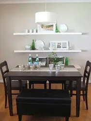 Shelves in the kitchen above the table in the interior