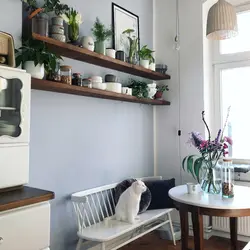 Shelves in the kitchen above the table in the interior