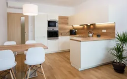 Glossy kitchen with wooden countertops in the interior