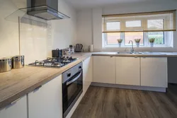 Glossy kitchen with wooden countertops in the interior