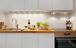 Glossy kitchen with wooden countertops in the interior