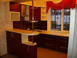 Kitchens with a closed bar counter photo