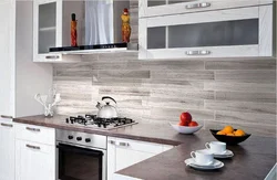 Photo of a kitchen with a gray stove