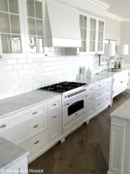 Photo of a kitchen with a gray stove