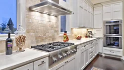 Photo of a kitchen with a gray stove