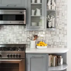 Photo of a kitchen with a gray stove