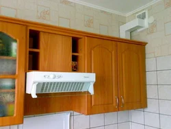 How to attach the hood in the kitchen above the stove to the wall photo