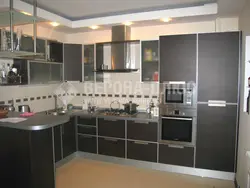 Kitchen Design With Built-In Appliances And Refrigerator