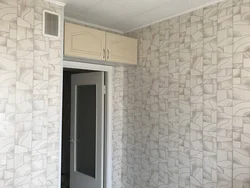 Kitchen and hallway with wallpaper photo in the interior