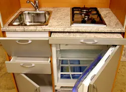 Stove and sink in a small kitchen photo