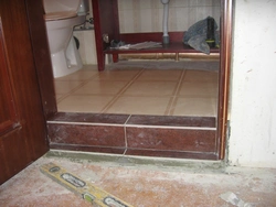 No thresholds to the bathroom photo