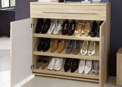 Wooden shoe racks in the hallway photo