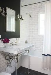 Bathtub with white tiles and gray grout photo