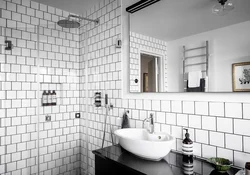 Bathtub With White Tiles And Gray Grout Photo