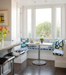 Photo of a kitchen with a table by the window photo