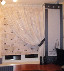 Roller blinds with tulle in the kitchen interior