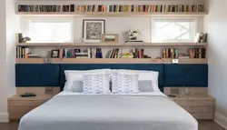 Shelves above the bed in the bedroom photo