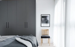 Gray wardrobe in the bedroom interior photo