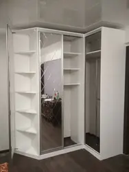 Corner wardrobes in the living room with a mirror photo