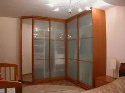 Corner wardrobes in the living room with a mirror photo