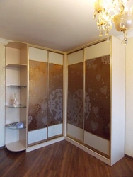 Corner wardrobes in the living room with a mirror photo