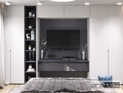 Wardrobe with built-in TV in the living room photo