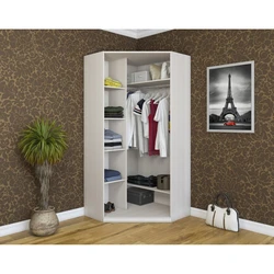 Corner wardrobe for clothes in the bedroom with a mirror photo