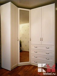 Corner Wardrobe For Clothes In The Bedroom With A Mirror Photo