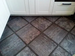 Tiles On The Floor In The Kitchen With A Transition Photo