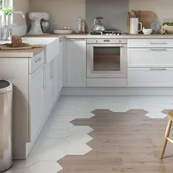 Tiles on the floor in the kitchen with a transition photo