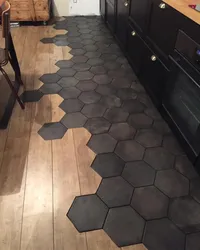 Tiles on the floor in the kitchen with a transition photo