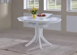 Round table for the kitchen on one leg in the interior
