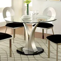 Round table for the kitchen on one leg in the interior
