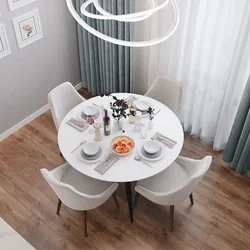 Round table for the kitchen on one leg in the interior