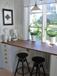 Photo of a kitchen with a dining table by the window