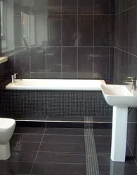 Photo of a bathroom with a dark bottom