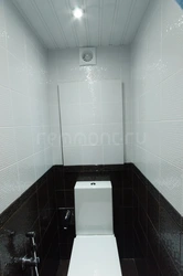 Photo of a bathroom with a dark bottom